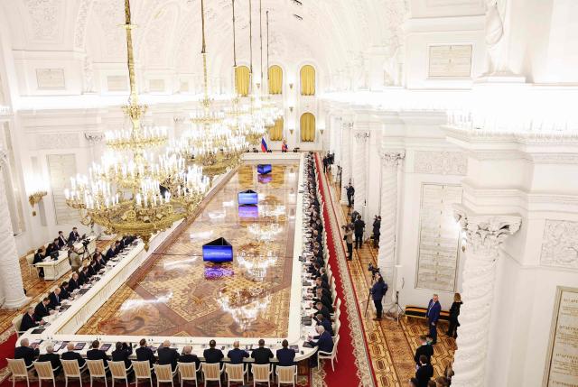 In this pool photograph distributed by the Russian state agency Sputnik, Russia's President Vladimir Putin chairs a State Council meeting at the Kremlin in Moscow on December 25, 2025. (Photo by Alexander KAZAKOV / POOL / AFP)