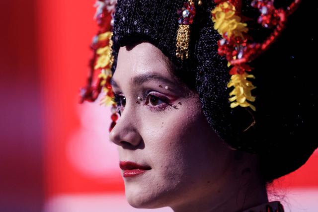 A woman representing Japan looks on during the final press conference at the Boulevard Entertainment City, In Riyadh on December 25, 2025, ahead of the final major fight card of the year between Japan's boxer Naoya Inoue and David Picasso presented by the Riyadh season entitled "The Ring V night of Samurai". The fight will take place at the Mohammed Abdo Arena, in Riyadh on December 27, 2025. (Photo by Fayez Nureldine / AFP)