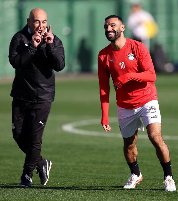 Egypt's head coach Hossam Hassan and Egypt's forward #10 Mohamed Salah take part in a training session at the Stadium in Taghzout, Morocco, on December 25, 2025, on the eve of the 2025 Africa Cup of Nations (CAN) football match between Egypt and South Africa. (Photo by FRANCK FIFE / AFP)