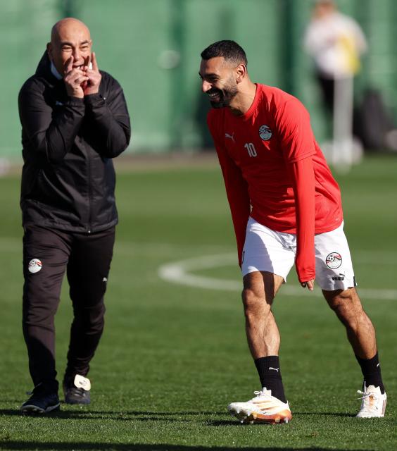 Egypt's head coach Hossam Hassan and Egypt's forward #10 Mohamed Salah attend a training session at the Stadium in Taghzout, Morocco, on December 25, 2025, on the eve of the 2025 Africa Cup of Nations (CAN) football match between Egypt and South Africa. (Photo by FRANCK FIFE / AFP)