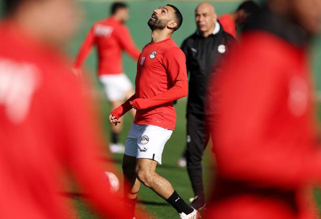 Egypt's head coach Hossam Hassan  and Egypt's forward #10 Mohamed Salah attend a training session at the Stadium in Taghzout, Morocco, on December 25, 2025, on the eve of the 2025 Africa Cup of Nations (CAN) football match between Egypt and South Africa. (Photo by FRANCK FIFE / AFP)