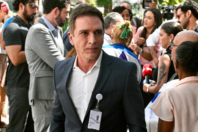 The cardiologist of former Brazil's President (2019–2023) Jair Bolsonaro, Brasil Ramos Caiado, leaves after speaking with the press following Bolsonaro's inguinal hernia surgery, at DF Star Hospital, in Brasнlia, on December 25, 2025. Bolsonaro, who is serving a 27-year prison sentence for an attempted coup, underwent a "successful" surgery his wife announced in an Instagram post. (Photo by Evaristo Sa / AFP)