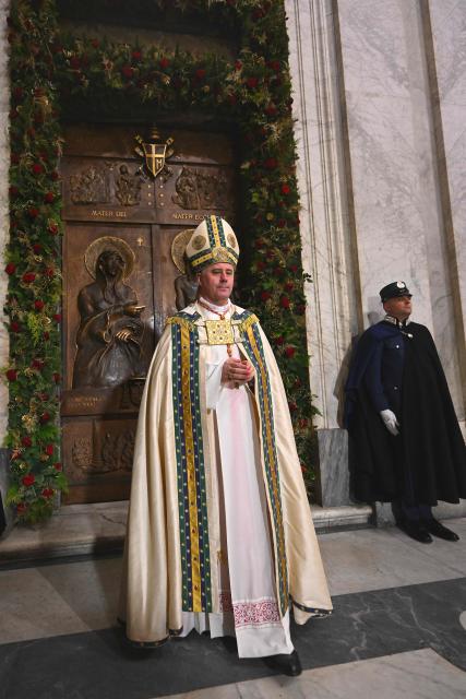 Lithuanian Cardinal Rolandas Makrickas, Archpriest of the Papal Basilica of Santa Maria Maggiore in Rome, celebrates the closing a Holy Door on December 25, 2025, as part of the end of the Catholic Jubilee Year.  (Photo by Andreas SOLARO / POOL / AFP)