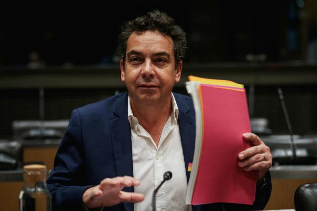 (FILES) French journalist Patrick Cohen French journalist Patrick Cohen sits prior to the start of a hearing before the Public Audiovisual Committee of Inquiry at the National Assembly building, France's Parliament lower house, in Paris on December 18, 2025. The Paris public prosecutor's office confirmed to AFP on December 21, 2025, that it had opened an investigation into the clandestine recording of a conversation between journalists Patrick Cohen and Thomas Legrand. Legrand has also filed a new complaint following the disclosure of information about another private conversation with a former boss at France Inter radio station. (Photo by Dimitar DILKOFF / AFP)