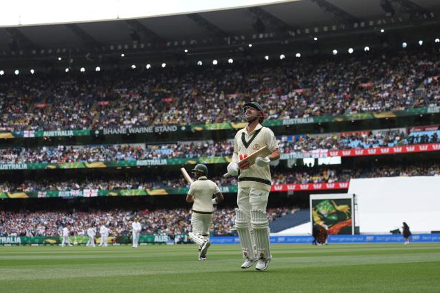 Australia's Travis Head walks out to bat during the first day of the fourth Ashes cricket Test match between Australia and England at the Melbourne Cricket Ground (MCG) in Melbourne, Australia on December 26, 2025. (Photo by Martin KEEP / AFP)