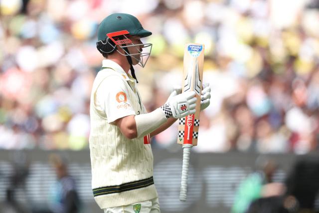Australia's Travis Head leaves the field after being dismissed during the first day of the fourth Ashes cricket Test match between Australia and England at the Melbourne Cricket Ground (MCG) in Melbourne on December 26, 2025. (Photo by Martin KEEP / AFP)