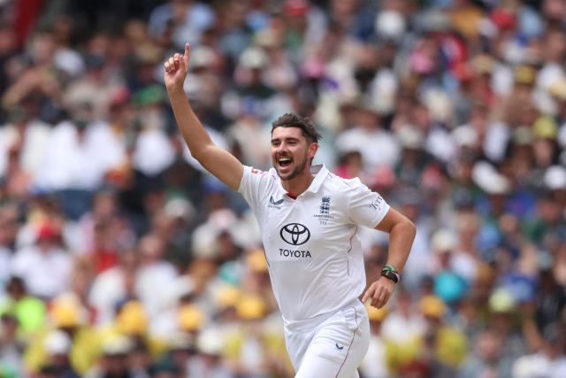 England's Josh Tongue celebrates after dismissing Australia's Jake Weatherald during the first day of the fourth Ashes cricket Test match between Australia and England at the Melbourne Cricket Ground (MCG) in Melbourne on December 26, 2025. (Photo by Martin KEEP / AFP)