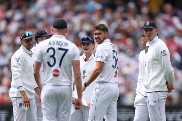 England players celebrate after Josh Tongue takes the wicket of Australia's Jake Weatherald during the first day of the fourth Ashes cricket Test match between Australia and England at the Melbourne Cricket Ground (MCG) in Melbourne on December 26, 2025. (Photo by Martin KEEP / AFP)