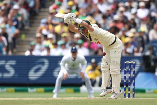 Australia's Marnus Labuschagne is hit by the ball during the first day of the fourth Ashes cricket Test match between Australia and England at the Melbourne Cricket Ground (MCG) in Melbourne on December 26, 2025. (Photo by Martin KEEP / AFP)