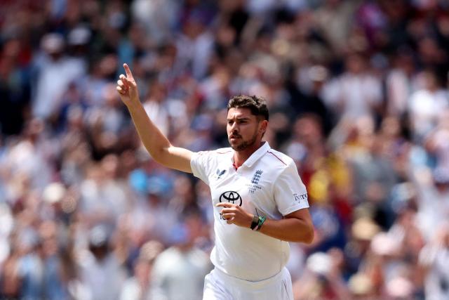 England's Josh Tongue celebrates after dismissing Australia's Marnus Labuschagne during the first day of the fourth Ashes cricket Test match between Australia and England at the Melbourne Cricket Ground (MCG) in Melbourne on December 26, 2025. (Photo by Martin KEEP / AFP)