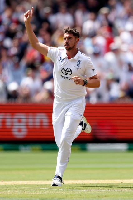 England's Josh Tongue celebrates after dismissing Australia's Marnus Labuschagne during the first day of the fourth Ashes cricket Test match between Australia and England at the Melbourne Cricket Ground (MCG) in Melbourne on December 26, 2025. (Photo by Martin KEEP / AFP)
