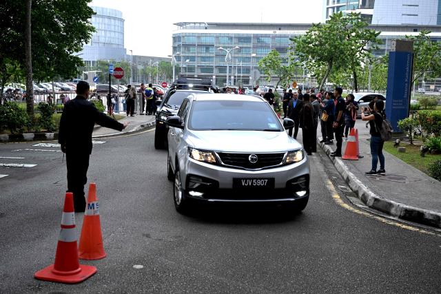 A convoy carrying Malaysia’s former prime minister Najib Razak arrives at the Palace of Justice, which houses the Malaysian Court of Appeal and Federal Court, in Putrajaya on December 26, 2025, ahead of his verdict in the 1MDB trial. (Photo by Mohd RASFAN / AFP)