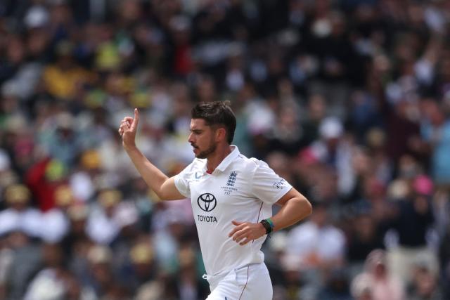 England's Josh Tongue celebrates the wicket of Australia's Steve Smith during the first day of the fourth Ashes cricket Test match between Australia and England at the Melbourne Cricket Ground (MCG) in Melbourne on December 26, 2025. (Photo by Martin KEEP / AFP)