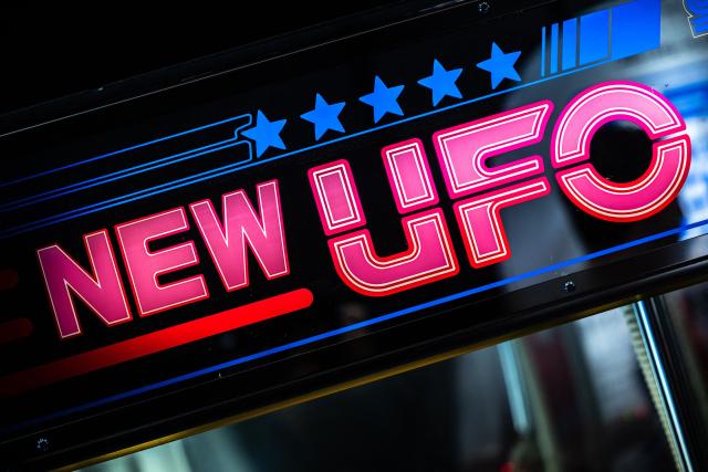 This picture taken on November 14, 2025 shows a section of the "New UFO Catcher" claw crane game machine at Japanese video game and entertainment company Sega's booth during the Amusement Expo 2025 in Tokyo. As school and work wraps up, crowds gradually fill Tokyo's many bustling arcade halls —- not to battle it out in fighting games, but to snag plush toys from claw machines. (Photo by Philip FONG / AFP) / To go with 'JAPAN-ANIMATION-GAME-ARCADE, FOCUS' by Mathias Cena