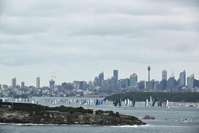 Yachts compete at the start of the annual Sydney to Hobart yacht race on Boxing Day at Sydney Harbour on December 26, 2025. (Photo by Saeed KHAN / AFP)