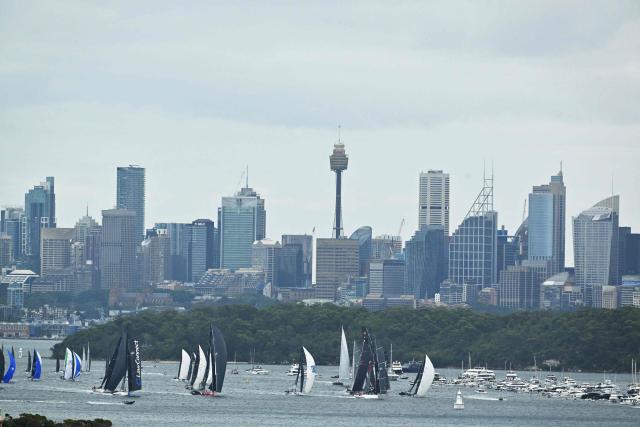 Yachts compete at the start of the annual Sydney to Hobart yacht race on Boxing Day at Sydney Harbour on December 26, 2025. (Photo by Saeed KHAN / AFP)