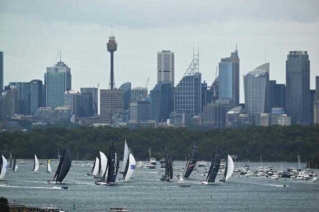 Yachts compete at the start of the annual Sydney to Hobart yacht race on Boxing Day at Sydney Harbour on December 26, 2025. (Photo by Saeed KHAN / AFP)