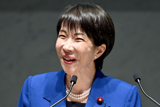 This photo taken on December 25, 2025 shows Japan's Prime Minister Sanae Takaichi delivering a speech at the 14th Council Meeting of the Japan Business Federation, or Keidanren, in Tokyo. The Japanese government approved on December 26, a record budget for the upcoming fiscal year, media reported, to pay for everything from bigger defence spending to ballooning social security costs as persistent inflation continues to bite. (Photo by Kazuhiro NOGI / AFP)