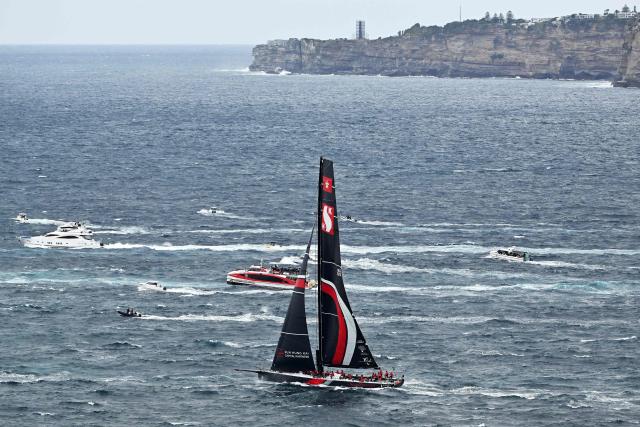 SHK Scallywag 100 competes out of Sydney Heads during the annual Sydney to Hobart yacht race on Boxing Day at Sydney Harbour on December 26, 2025. (Photo by Saeed Khan / AFP)