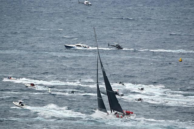 Yacht Lucky competes out of Sydney Heads during the annual Sydney to Hobart yacht race on Boxing Day at Sydney Harbour on December 26, 2025. (Photo by Saeed Khan / AFP)