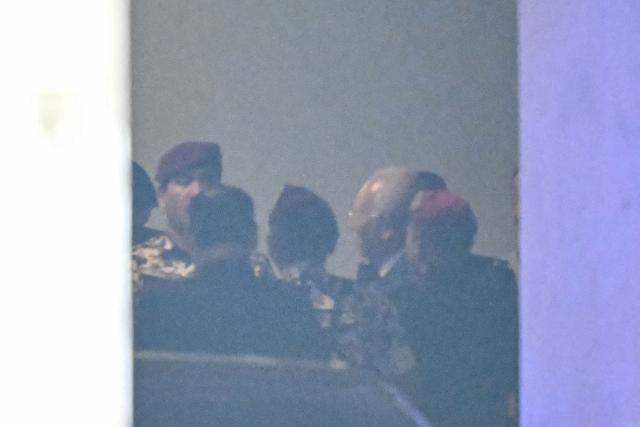 Malaysia's former prime minister Najib Razak (2nd R) leaves to attend Friday prayers during a break in the 1MDB trial at the Palace of Justice, which houses the Malaysian Court of Appeal and Federal Court, in Putrajaya on December 26, 2025. (Photo by MOHD RASFAN / AFP)