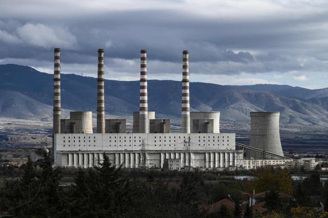 This photograph shows Kardia, an interrupted lignite-fired power plant near Kozani, in northwestern Greece on November 20, 2025. As part of an environmental drive that became known as the European Union Green Deal, Greece in 2019 decided to drastically cut back on the use of lignite in electricity production. Despite decades of air and water pollution that have verifiably caused cancer and other ailments, the residents of Agios Dimitrios village will be sorry to see the Public Power Corporation plant -- a source of employment for many -- decommissioned. The Agios Dimitrios plant, just a few hundred metres from the village, is scheduled to shut in May 2026. (Photo by Sakis Mitrolidis / AFP)