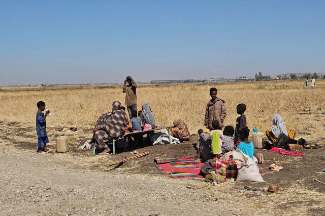 Displaced Sudanese react after spending a night in Gedaref city eastern Sudan on December 26, 2025 after the Rapid Support Forces (RSF) took control of the Heglig area in western Sudan. Since its outbreak in April 2023, the war between Sudan's army and the paramilitary Rapid Support Forces (RSF) has killed tens of thousands of people and displaced nearly 12 million. At the end of October, the paramilitary group seized control El-Fasher, the conclusion of a bitter 18-month siege for the strategic hub in western Sudan's Darfur region and marked by reports of mass killings and sexual violence. (Photo by AFP)