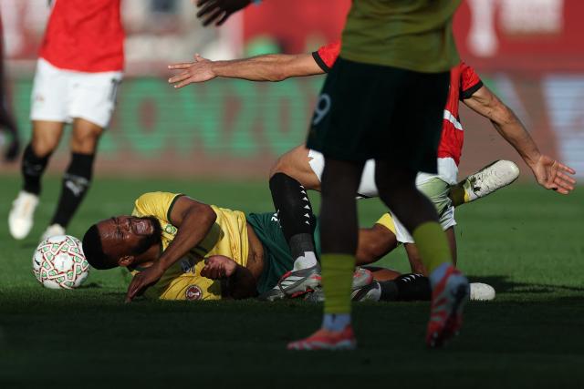 South Africa's midfielder #17 Sipho Mbule reacts in a tackle during the Africa Cup of Nations (CAN) Group B football match between Egypt and South Africa at Adrar Stadium in Agadir on December 26, 2025. (Photo by FRANCK FIFE / AFP)