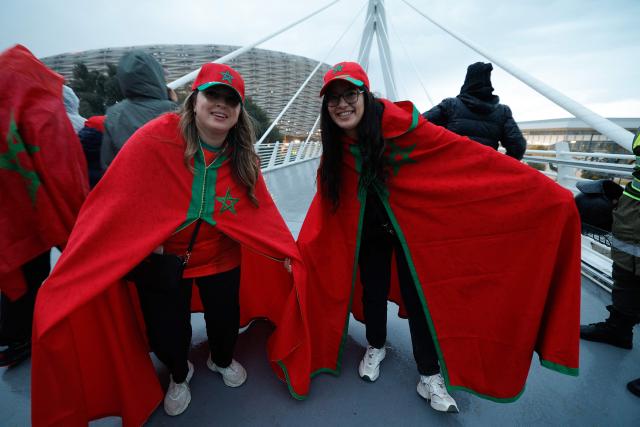 Morocco supporters arrive for the Africa Cup of Nations (CAN) Group A football match between Morocco and Mali at Prince Moulay Abdellah Stadium in Rabat on December 26, 2025. (Photo by Abdel Majid BZIOUAT / AFP)
