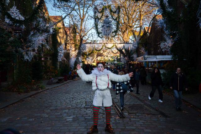An artist performs during the annual Festival du Merveilleux at the Musee des Arts Forains in Paris on December 26, 2025. (Photo by Dimitar DILKOFF / AFP)