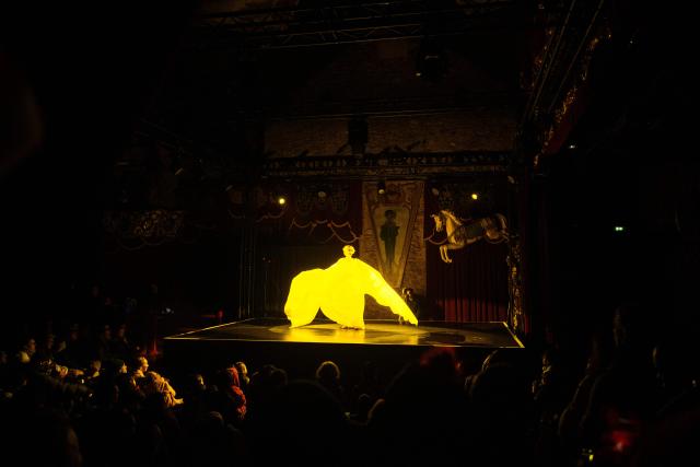 French Laurette de Paname dances during the annual Festival du Merveilleux at the Musee des Arts Forains in Paris on December 26, 2025. (Photo by Dimitar DILKOFF / AFP)