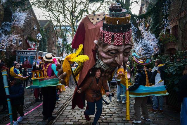 An artist performs during the annual Festival du Merveilleux at the Musee des Arts Forains in Paris on December 26, 2025. (Photo by Dimitar DILKOFF / AFP)