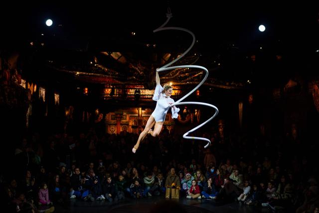 TOPSHOT - French acrobat Nathalie Jeanson performs during the annual Festival du Merveilleux at the Musee des Arts Forains in Paris on December 26, 2025. (Photo by Dimitar DILKOFF / AFP)