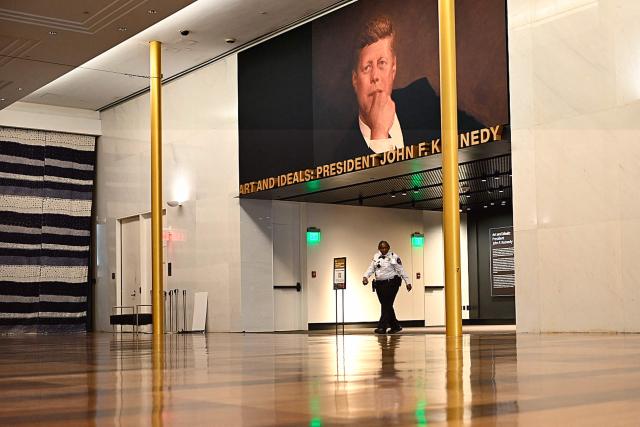 A security guard walks through the John F. Kennedy Center for the Performing Arts, which was recently renamed the "Trump Kennedy Center," in Washington, DC, on December 26, 2025. US President Donald Trump's name was affixed to the Kennedy Center in Washington on December 19, 2025, one day after his hand-picked board members voted to rename the arts venue in spite of legal questions. (Photo by Brendan Smialowski / AFP)