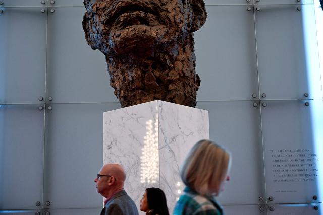 People visit the John F. Kennedy Center for the Performing Arts, which was recently renamed the "Trump Kennedy Center," in Washington, DC,  on December 26, 2025. US President Donald Trump's name was affixed to the Kennedy Center in Washington on December 19, 2025, one day after his hand-picked board members voted to rename the arts venue in spite of legal questions. (Photo by Brendan Smialowski / AFP)