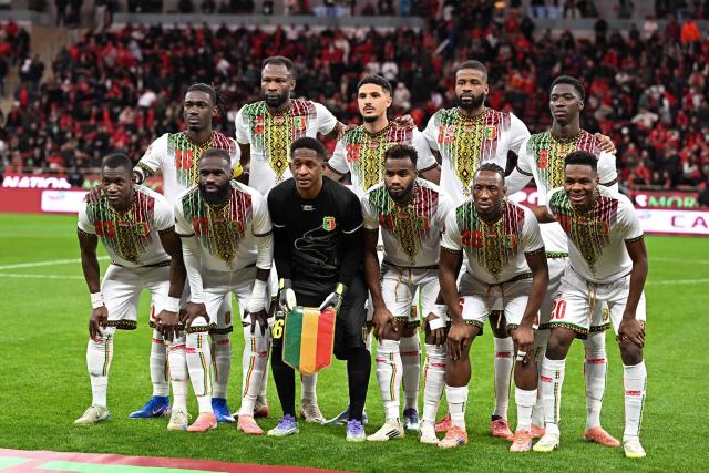 The Mali team line up ahead of the Africa Cup of Nations (CAN) Group A football match between Morocco and Mali at Prince Moulay Abdellah Stadium in Rabat on December 26, 2025. (Photo by Gabriel BOUYS / AFP)
