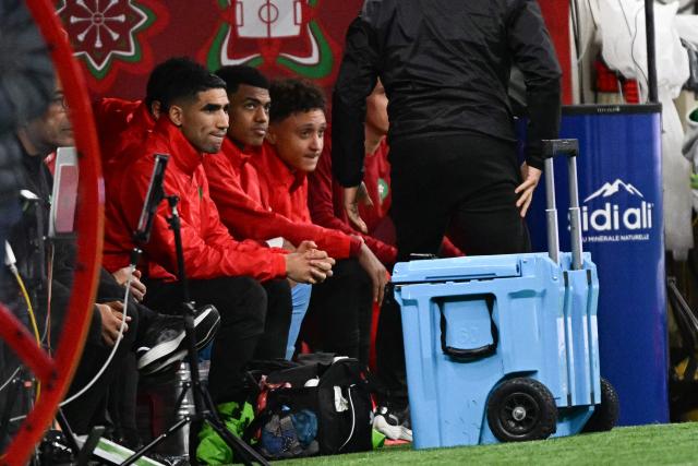 Morocco's defender #02 Achraf Hakimi sits on the substitutes bench during the Africa Cup of Nations (CAN) Group A football match between Morocco and Mali at Prince Moulay Abdellah Stadium in Rabat on December 26, 2025. (Photo by Gabriel BOUYS / AFP)