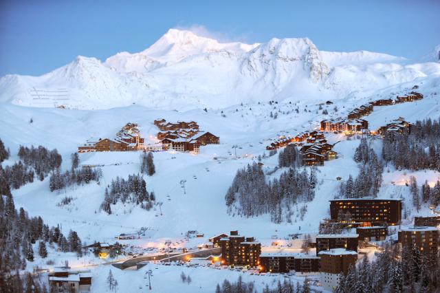 (FILES) This photograph shows a general view of La Plagne ski resort, south eastern France, on January 6, 2010. Two people died on December 26, 2025, in avalanches in winter resorts in the French Alps, local authorities said, calling on skiers to be wary of changing weather conditions. A 60-year-old mountain guide died after he and a group he was leading were caught by an avalanche in an off-piste sector of the La Plagne resort with a second skier dying after being swept away by an avalanche hours later near the village of Valloire beneath Mount Jovet.

Four cross-country skiers were swept away by the avalanche. One of them suffered cardiac arrest and could not be resuscitated. Two others were slighty injured. (Photo by JEAN-PIERRE CLATOT / AFP)