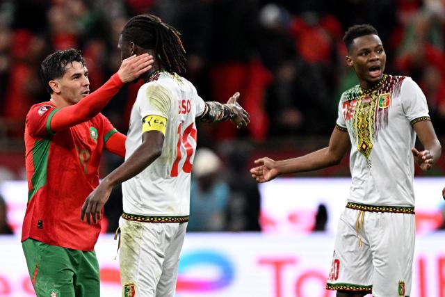 Morocco's forward #10 Brahim Diaz and Mali's midfielder #10 Yves Bissouma exchange words after Morocco's forward #10 Brahim Diaz scored a penalty during the Africa Cup of Nations (CAN) Group A football match between Morocco and Mali at Prince Moulay Abdellah Stadium in Rabat on December 26, 2025. (Photo by Gabriel BOUYS / AFP)