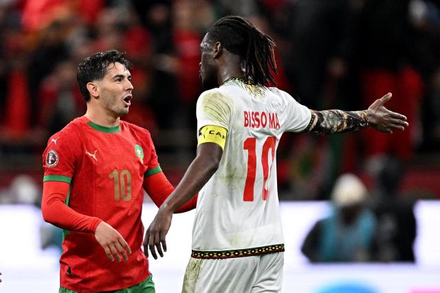 Morocco's forward #10 Brahim Diaz and Mali's midfielder #10 Yves Bissouma exchange words after Morocco's forward #10 Brahim Diaz scored a penalty during the Africa Cup of Nations (CAN) Group A football match between Morocco and Mali at Prince Moulay Abdellah Stadium in Rabat on December 26, 2025. (Photo by Gabriel BOUYS / AFP)