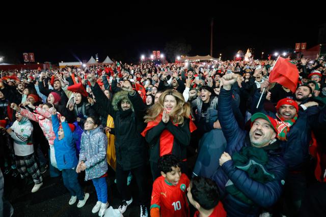 Morocco supporters react at the Rabat Fanzone as they watch the Africa Cup of Nations (CAN) Group A football match between Morocco and Mali at Prince Moulay Abdellah Stadium in Rabat on December 26, 2025. (Photo by Abdel Majid BZIOUAT / AFP)