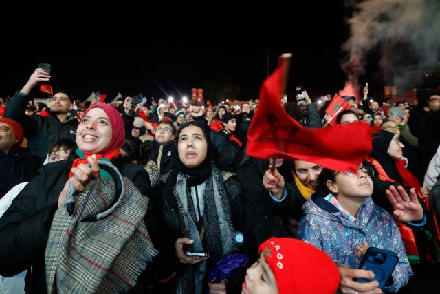 Morocco supporters react at the Rabat Fanzone as they watch the Africa Cup of Nations (CAN) Group A football match between Morocco and Mali at Prince Moulay Abdellah Stadium in Rabat on December 26, 2025. (Photo by Abdel Majid BZIOUAT / AFP)