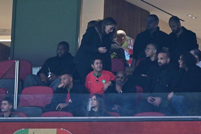 French footballer player Kylian Mbappe and French humorist, actor and producer Jamel Debbouze watch the Africa Cup of Nations (CAN) Group A football match between Morocco and Mali at Prince Moulay Abdellah Stadium in Rabat on December 26, 2025. (Photo by Gabriel BOUYS / AFP)