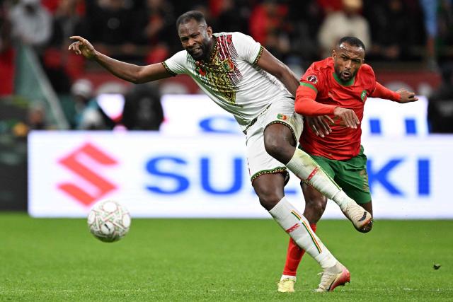 Mali's forward #09 El Bilal Toure (L) and Morocco's forward #20 Ayoub El Kaabi compete for the ball during the Africa Cup of Nations (CAN) Group A football match between Morocco and Mali at Prince Moulay Abdellah Stadium in Rabat on December 26, 2025. (Photo by Gabriel BOUYS / AFP)