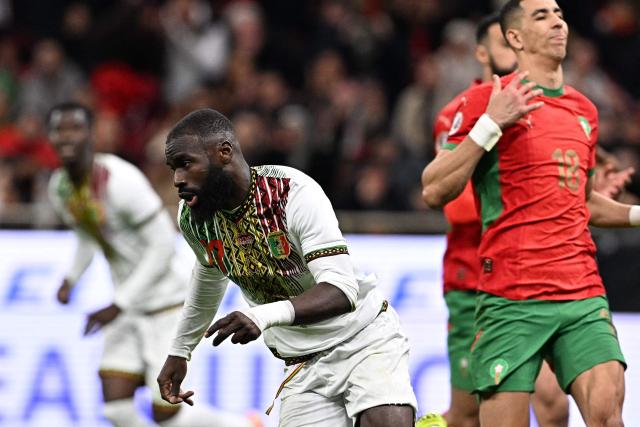 Mali's forward #17 Lassine Sinayoko scores a penalty during the Africa Cup of Nations (CAN) Group A football match between Morocco and Mali at Prince Moulay Abdellah Stadium in Rabat on December 26, 2025. (Photo by Gabriel BOUYS / AFP)