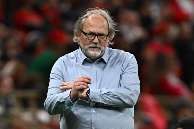 Mali's head coach Tom Saintfiet reacts after his team scored during the Africa Cup of Nations (CAN) Group A football match between Morocco and Mali at Prince Moulay Abdellah Stadium in Rabat on December 26, 2025. (Photo by Gabriel BOUYS / AFP)