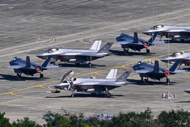 US military fighter F35-A jets sit on the tarmac at José Aponte de la Torre Airport, formerly Roosevelt Roads Naval Station, on December 26, 2025 in Ceiba, Puerto Rico. The United States has deployed a major military force in the Caribbean and has recently intercepted oil tankers as part of a naval blockade against Venezuelan vessels it considers to be under sanctions. Since September, US forces have launched dozens of air strikes on boats that Washington alleges, without showing evidence, were transporting drugs. More than 100 people have been killed. (Photo by Miguel J. Rodriguez Carrillo / AFP)