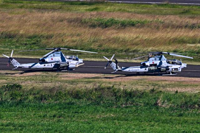 A US Marine Corps AH-1Z Viper attack helicopters sits on the tarmac at José Aponte de la Torre Airport, formerly Roosevelt Roads Naval Station, on December 26, 2025 in Ceiba, Puerto Rico. The United States has deployed a major military force in the Caribbean and has recently intercepted oil tankers as part of a naval blockade against Venezuelan vessels it considers to be under sanctions. Since September, US forces have launched dozens of air strikes on boats that Washington alleges, without showing evidence, were transporting drugs. More than 100 people have been killed. (Photo by Miguel J. Rodriguez Carrillo / AFP)