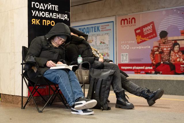 EDITORS NOTE: Graphic content / People take shelter at a metro station during Russian air attacks in Kyiv on December 27, 2025, amid the Russian invasion of Ukraine. Several powerful explosions rocked Kyiv on Saturday as authorities warned that the Ukrainian capital was under threat of missile attack.
"Explosions in the capital. Air defense forces are operating. Stay in shelters!" Kyiv's mayor Vitali Klitschko said on Telegram. (Photo by Serhii Okunev / AFP)