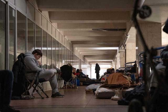 People take shelter at a metro station during Russian air attacks in Kyiv on December 27, 2025, amid the Russian invasion of Ukraine. Ukraine's air force announced a countrywide air alert and said drones and missiles were moving over several regions including Kyiv. (Photo by Serhii Okunev / AFP)